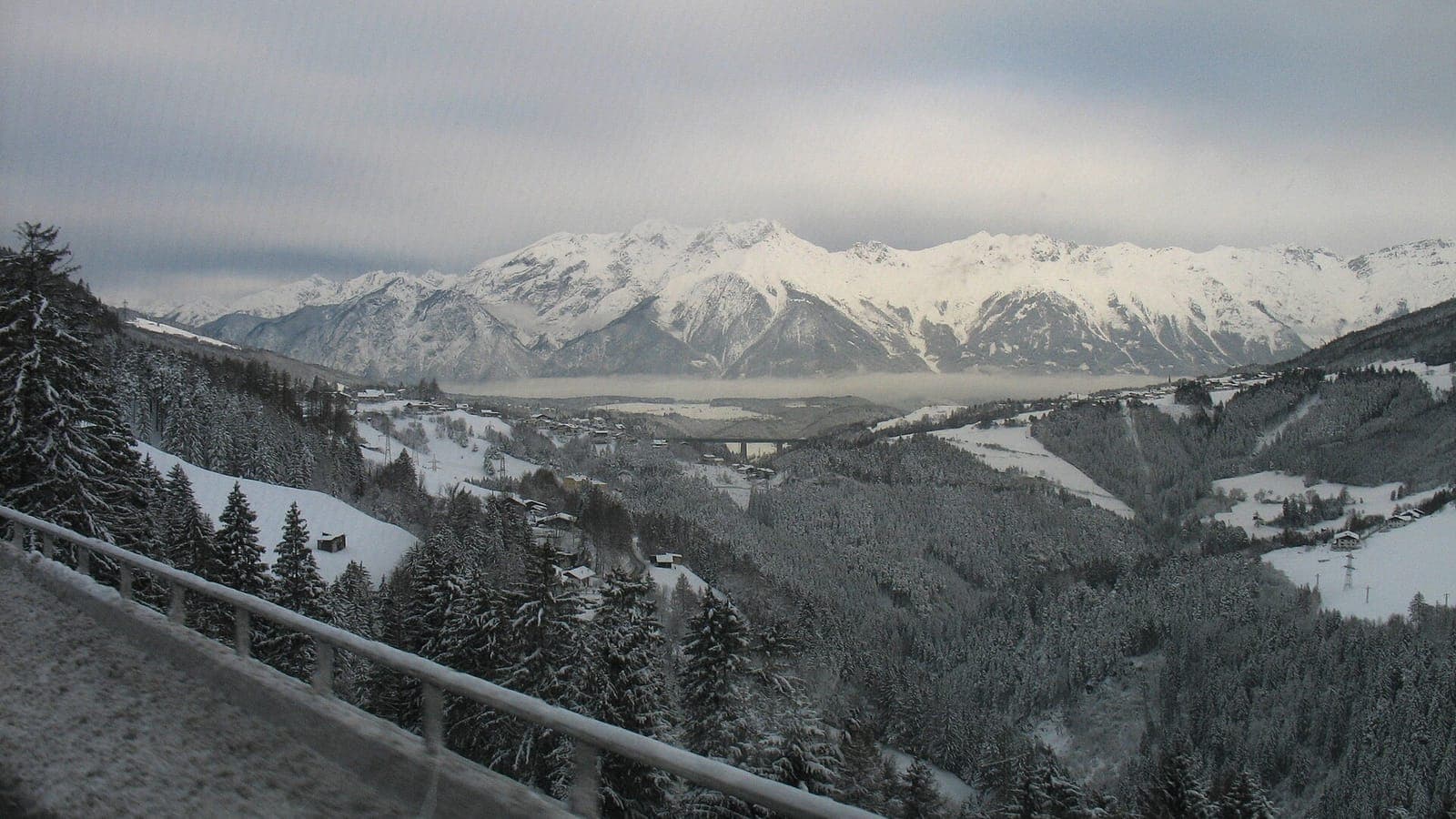 A föhn wall of cloud over the snowy Alps above the Wipptal valley in Tyrol