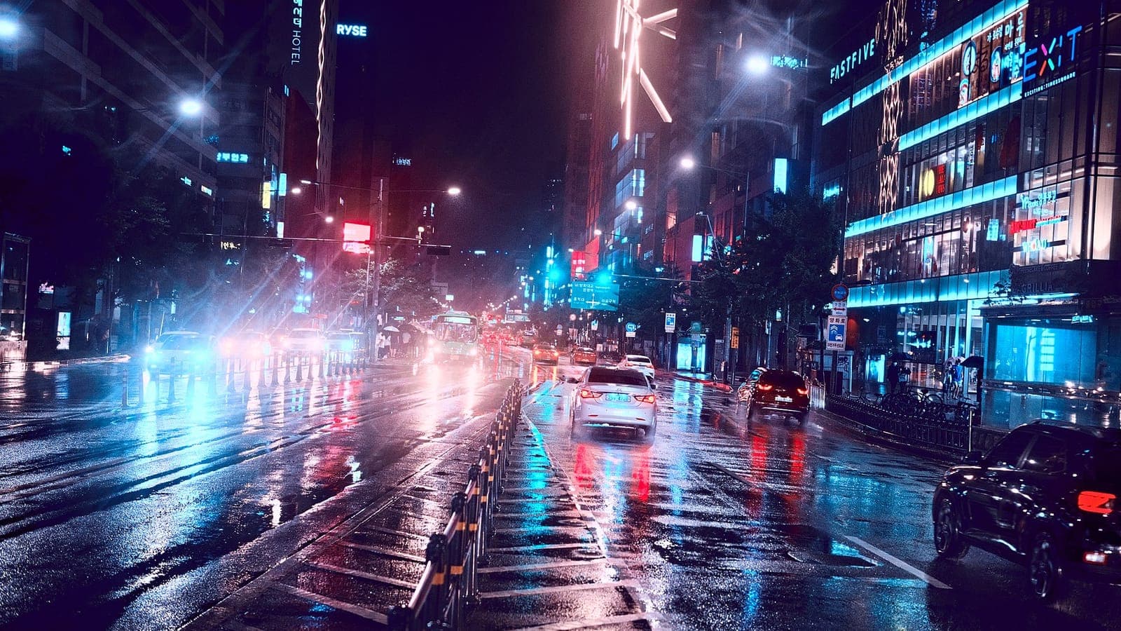 A rain-soaked night street in Seoul