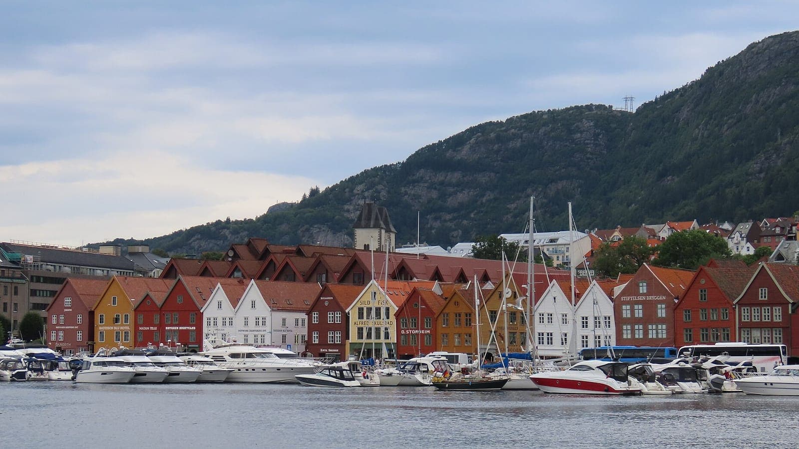 Rain clouds over the mountains and harbour of Bergen