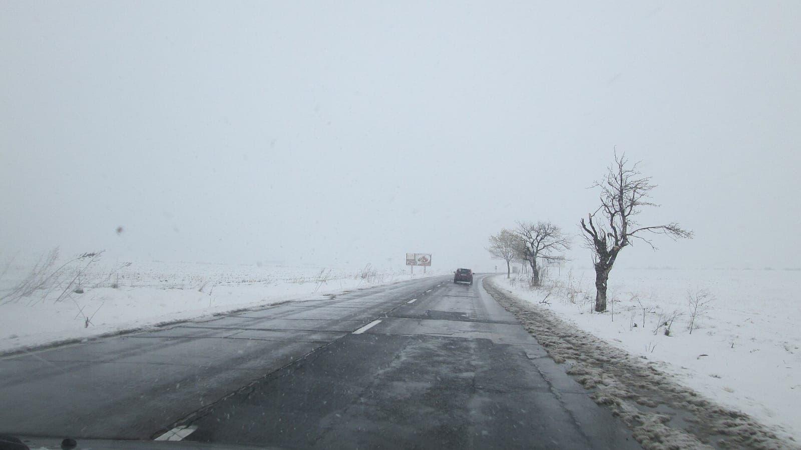 A road in a heavy snowstorm in Romania